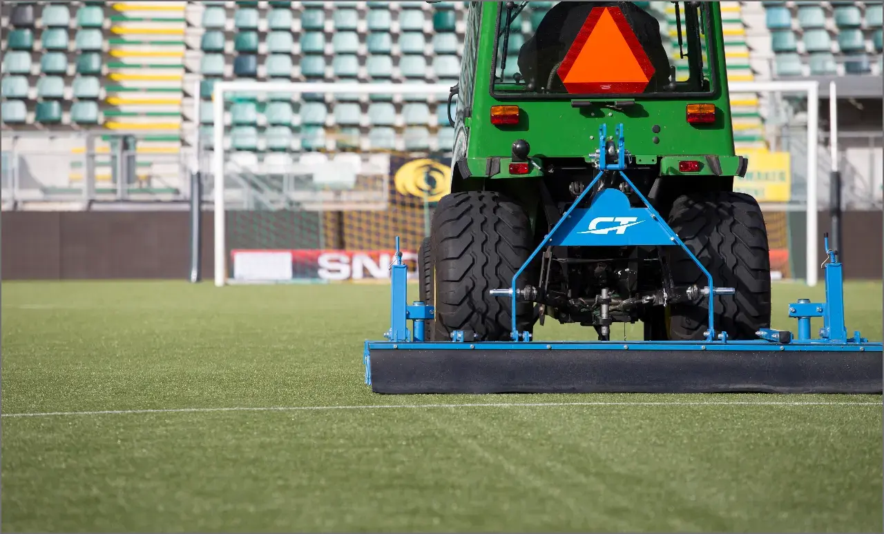 tractor doing turf maintenance  